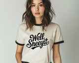 "Well Sheeyit" design on a natural ringer t-shirt with black contrast trim