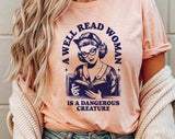 "A Well Read Woman" design on a peach unisex t-shirt