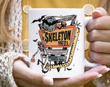 "The Skeleton Motel" Halloween design on a white coffee mug