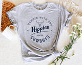 "Hanging With The Hippies And Cowboys" design on a heather gray unisex t-shirt