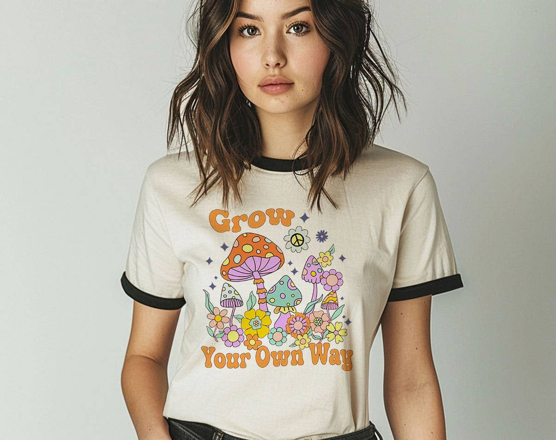 "Grow Your Own Way Mushroom" design on a natural ringer t-shirt with black contrast trim