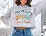 "Team Jeremiah Cousins Beach" design on an ash gray unisex crewneck sweatshirt