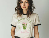 "Matcha Latte Social Club" design on a natural ringer t-shirt with black contrast trim
