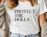 "Protect The Dolls" design on a white unisex t-shirt