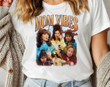 "Mom Vibes Peg & Roseanne" design on a white unisex t-shirt
