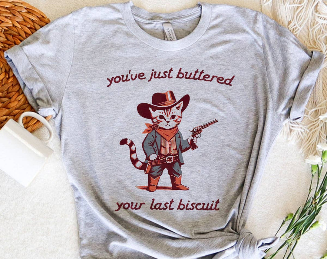 "You've Buttered Your Last Biscuit" design on a heather gray unisex t-shirt