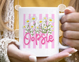 "Oopsie Daisy Flowers" design on a white ceramic coffee mug
