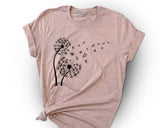 "Dandelion In The Wind" design on a peach unisex t-shirt