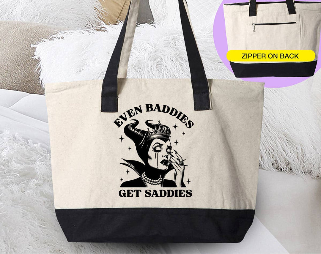 "Even Baddies Get Saddies" design on a natural canvas zippered tote bag