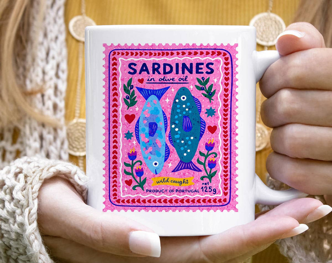 "Sardines Purple Stamp" design on a white ceramic coffee mug