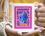 "Sardines Purple Stamp" design on a white ceramic coffee mug