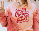 "Forget Flowers Buy Me Books" design on a peach unisex t-shirt