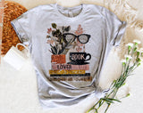 "Book Lover Collage Glasses" design on a heather gray unisex t-shirt