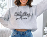 "Booktrovert" design on an ash gray unisex crewneck sweatshirt