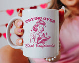 "Crying Over Book Boyfriends" design on a white ceramic coffee mug