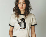 "Flight Was Never An Option Penguin" design on a natural ringer t-shirt with black contrast trim