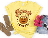 "Howdy Pumpkin" design on a pale yellow unisex t-shirt