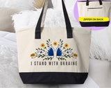 "I Stand With Ukraine" design on a natural canvas zippered tote bag