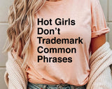 "Hot Girls Don't Trademark Common Phrases" design on a peach unisex t-shirt