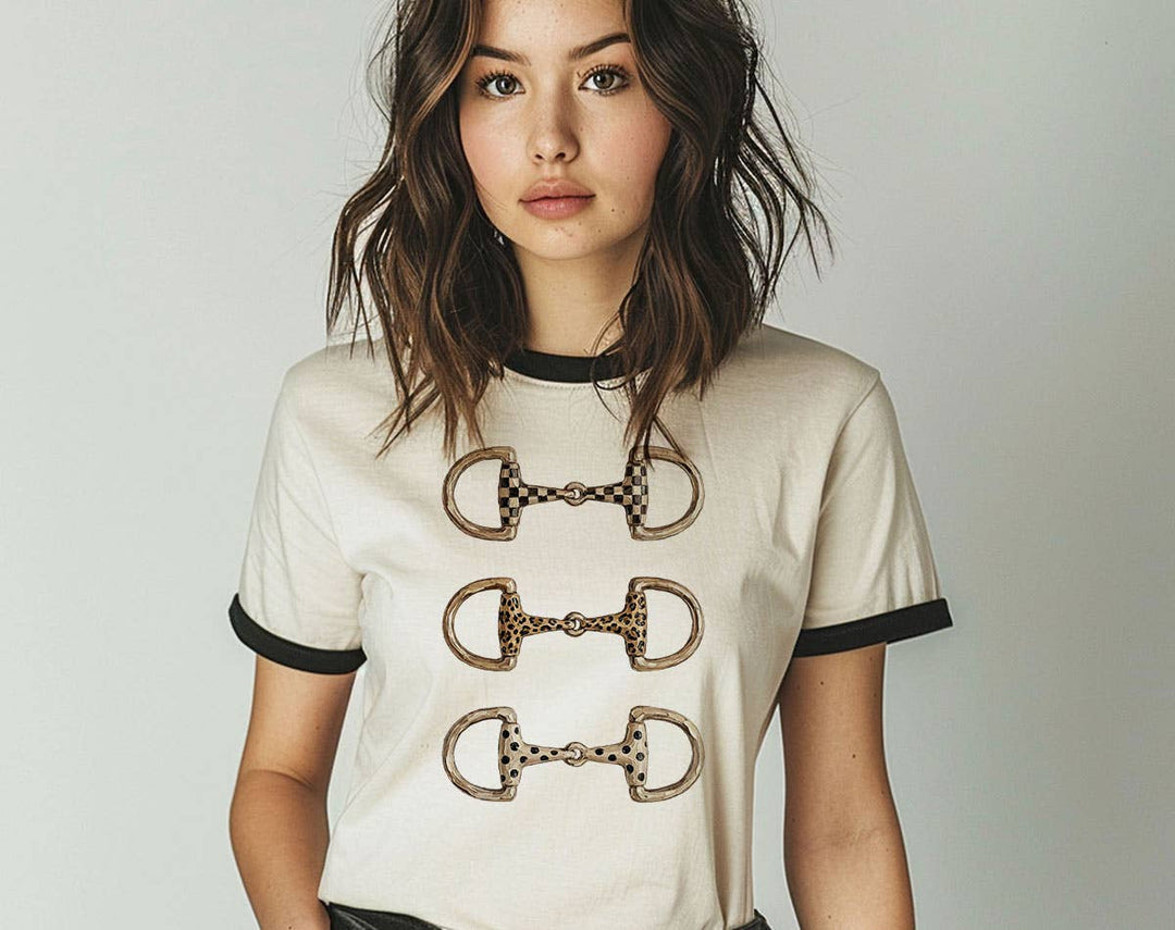 "Brushstroke Horse Bit Cowgirl" design on a natural ringer t-shirt with black contrast trim