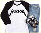 "Eddie Munson Logo" design on a white baseball raglan tee with black sleeves
