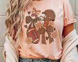 "Football Coquette Gameday Mama" design on a peach unisex t-shirt