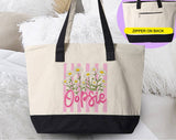"Oopsie Daisy Flowers" design on a natural canvas zippered tote bag