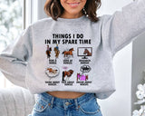 "Things I Do In Spare Time" design on an ash gray unisex crewneck sweatshirt