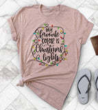 "My Favorite Color Is Christmas Lights" design on a peach unisex t-shirt