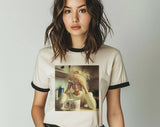 "Doll Face Meme Hot Mess Coffee" design on a natural ringer t-shirt with black contrast trim