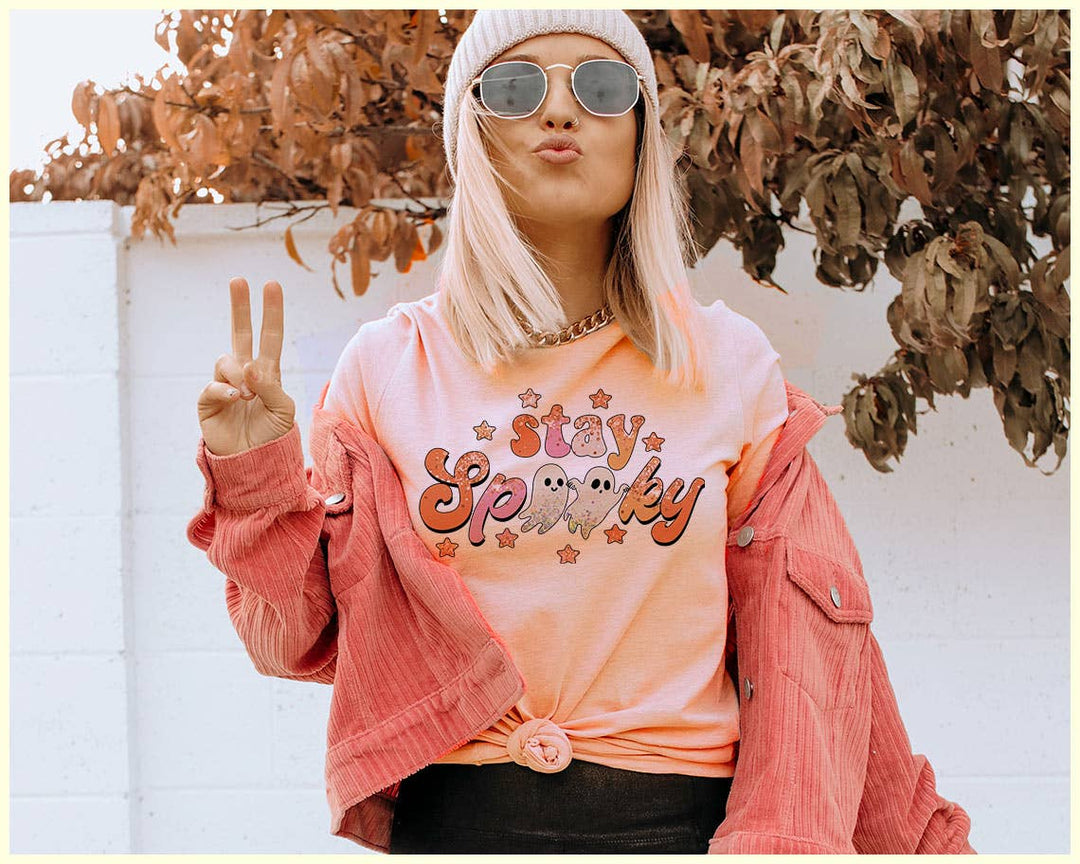 "Stay Spooky Ghost" design on a peach unisex t-shirt
