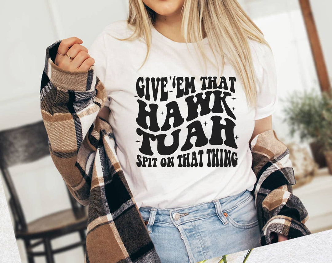 "Give 'Em That Hawk Tuah" design on a white unisex t-shirt