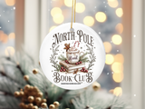 "North Pole Book Club" design on a 2.5 inch round ceramic Christmas ornament