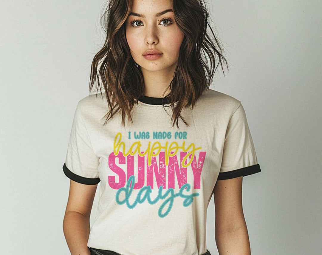 "I Was Made For Happy Sunny Days" design on a natural ringer t-shirt with black contrast trim