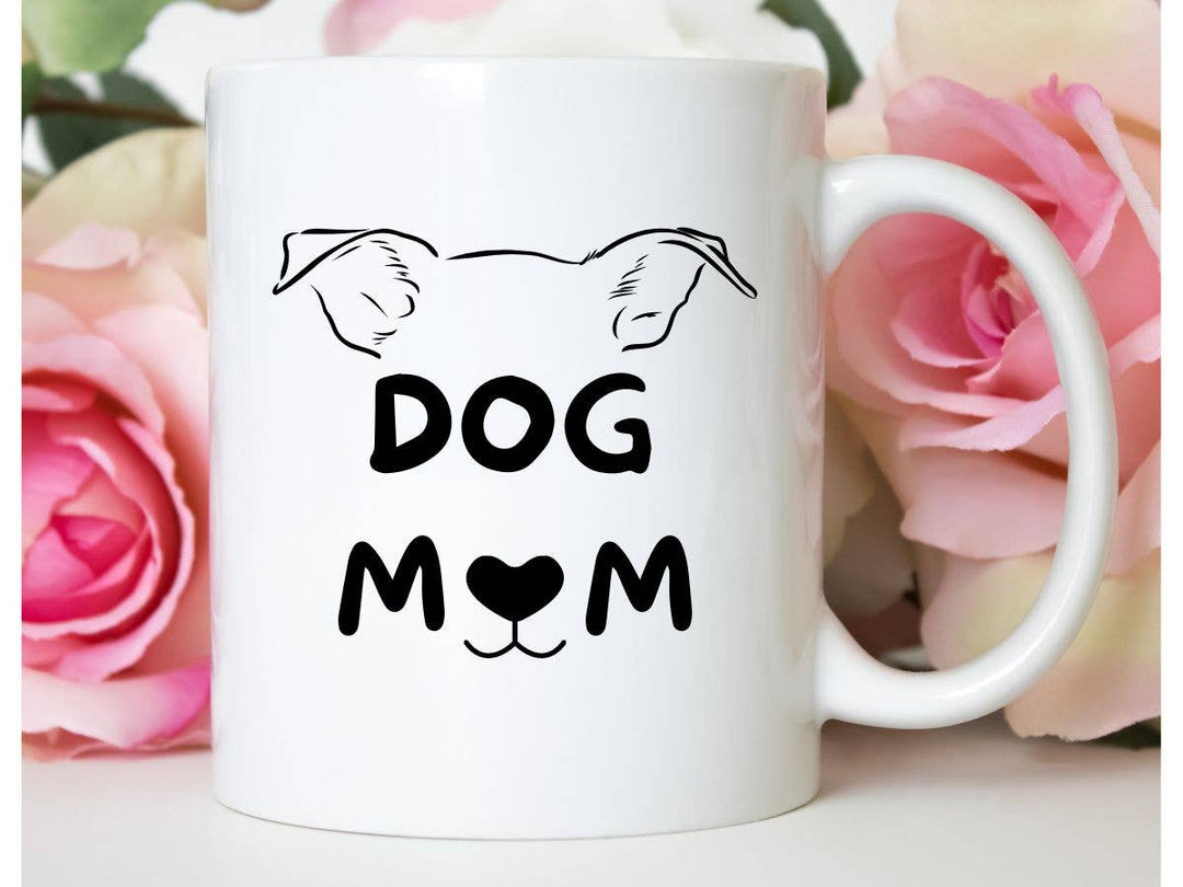 "Dog Mom" design on a white ceramic coffee mug