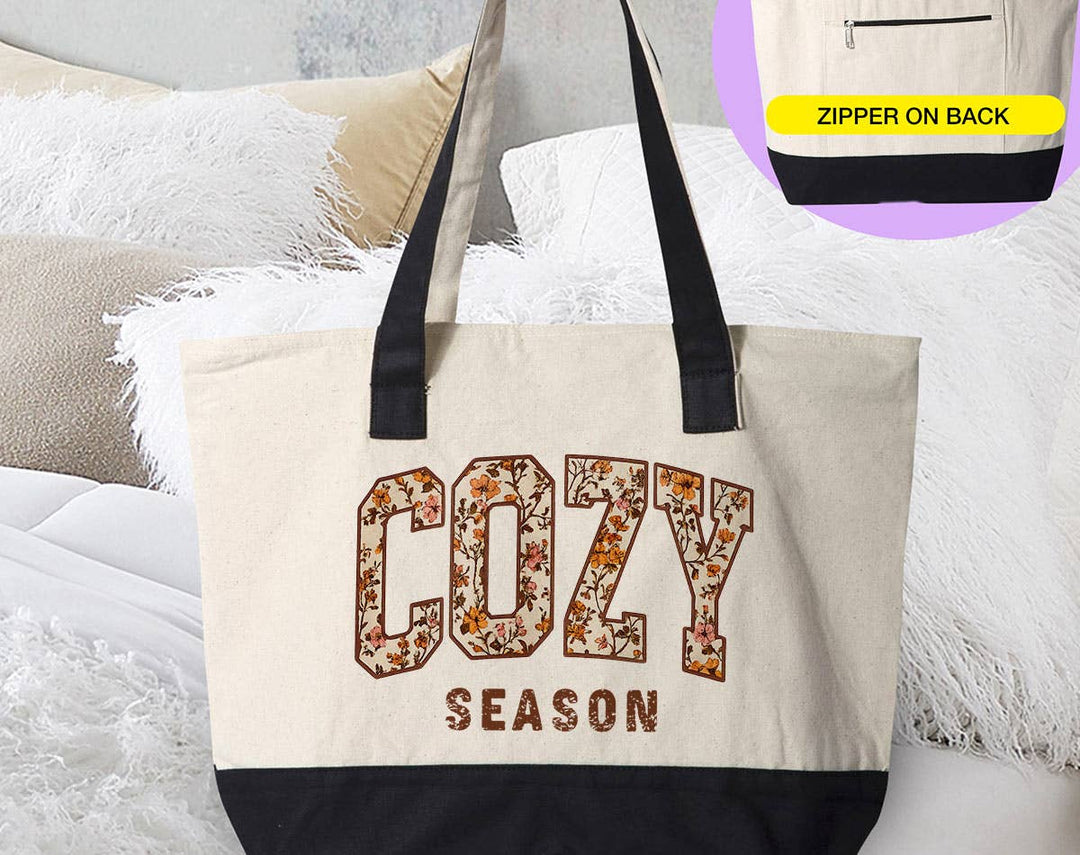 "Cozy Season Fall Leaves" design on a natural canvas zippered tote bag