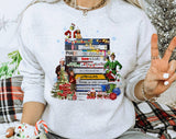 "Christmas Movies VHS Tapes" design on an ash gray unisex crewneck sweatshirt