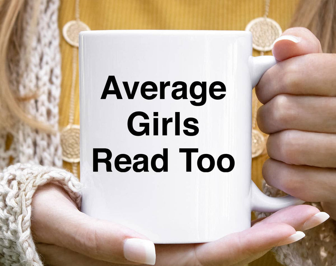 "Average Girls Read Too Hot Girl Trademark Book" design on a white ceramic coffee mug