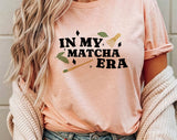 "In My Matcha Era" design on a peach unisex t-shirt