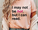 "I May Not Be Hot But I Can Read" design on a peach unisex t-shirt