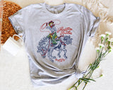 "Rootin' Tootin' Cowgirl" design on a heather gray unisex t-shirt