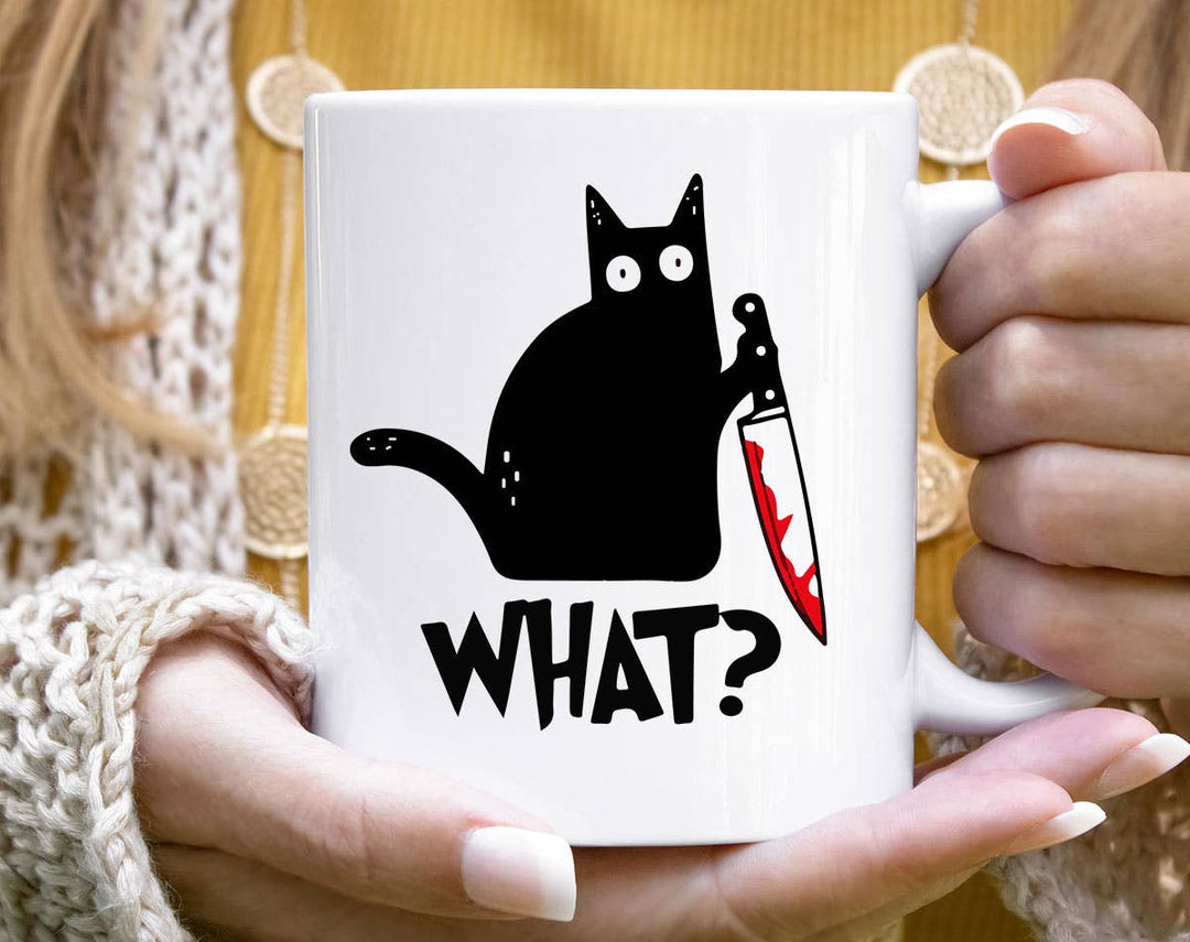 "Cat Knife What" design on a white ceramic coffee mug