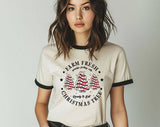 "Farm Fresh Christmas Tree Cakes" design on a natural ringer t-shirt with black contrast trim