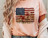 "American Flag Floral Painting" design on a peach unisex t-shirt