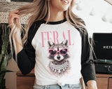 "Feral Vogue Raccoon" design on a white baseball raglan tee with black sleeves