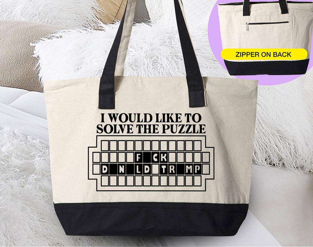 "Solve The Puzzle F*ck Trump" design on a natural canvas zippered tote bag