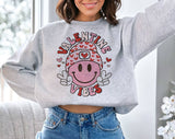 "Valentine Vibes Smiley Peace" design on an ash gray unisex crewneck sweatshirt