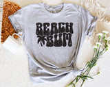 "Beach Bum" design on a heather gray unisex t-shirt