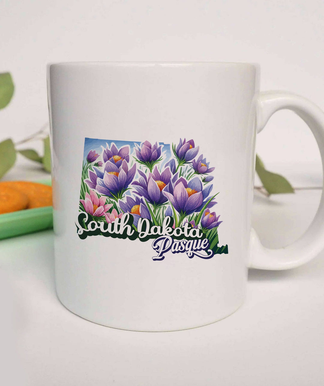 "South Dakota State Flower Pasque" design on a white ceramic coffee mug