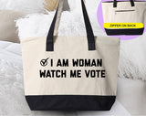 "I Am Woman, Watch Me Vote" design on a natural canvas zippered tote bag